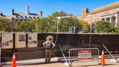 Onlooker watches Frederick Douglas Statue removal